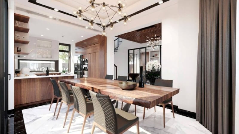 Ngoài điểm đặc biệt từ cách bố trí kệ trang trí, bàn đảo bằng đá granite màu trắng được thiết kế phô ra ngoài lại là điểm đáng chú ý, một mặt vẫn đảm bảo diện tích để chủ nhân có thể trưng bày món ăn thỏa mái, một mặt bạn lại có thể vừa nội trợ vừa có thể trông nom con học một cách dễ dàng. Thiết kế nội thất đá nhân tạo trong không gian nhà